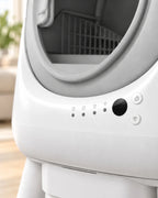 Litière automatique XXL à oreilles, gros plan des voyants et des boutons sous l'entrée grise
